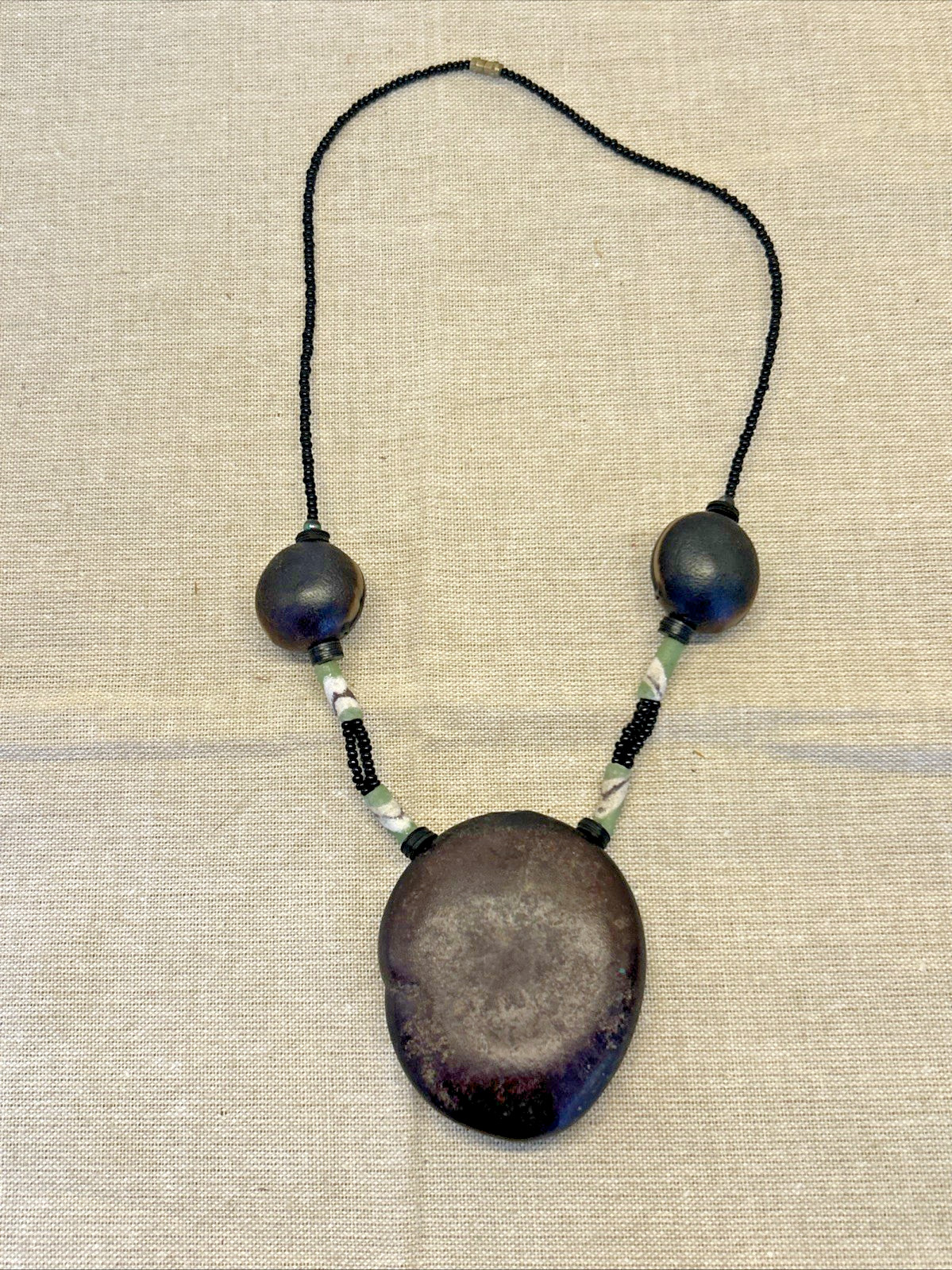 handmade boho-style natural seeds & artisanal clay beads necklace 18″