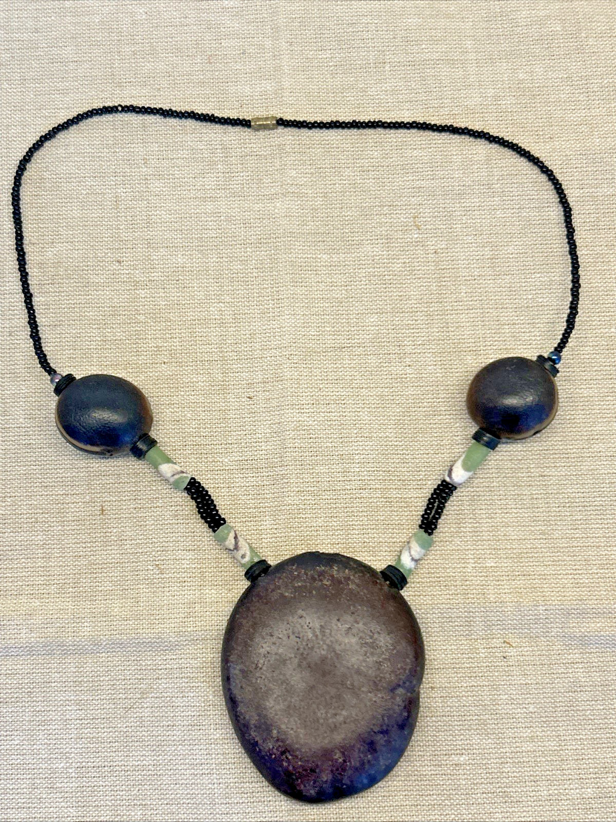 handmade boho-style natural seeds & artisanal clay beads necklace 18″
