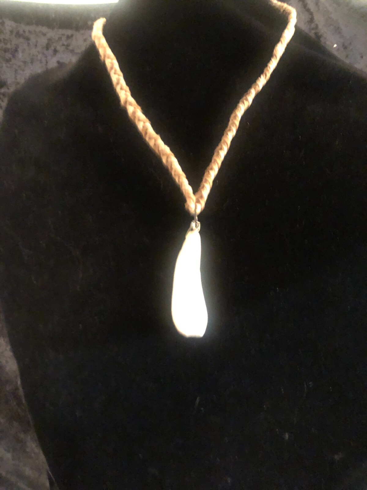 Buffalo tooth necklace with hand-braided, tan and light brown faux suede