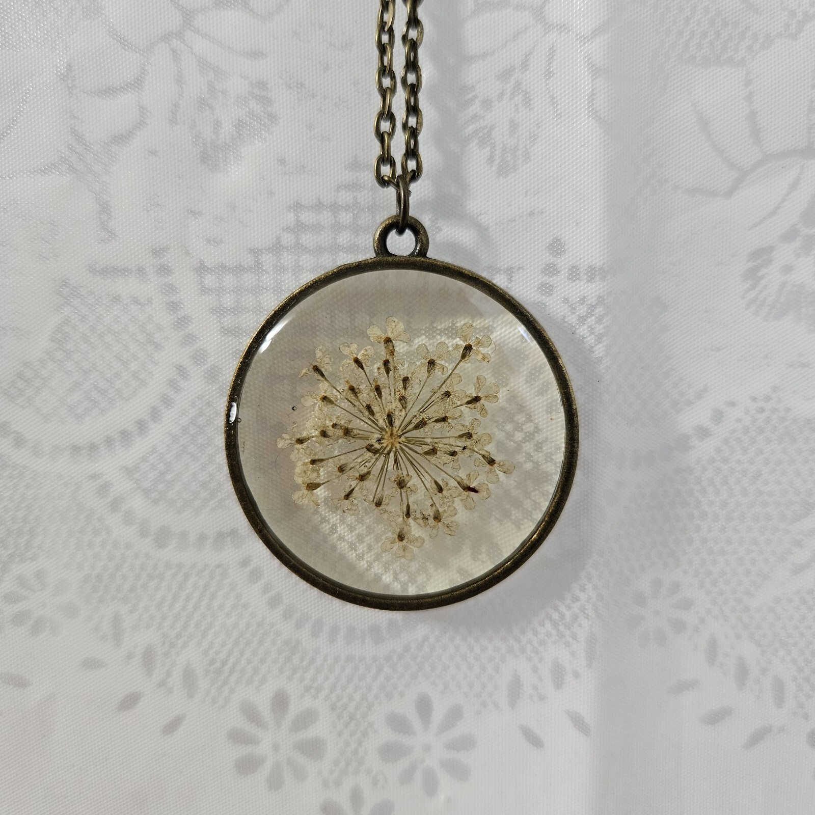 Round Pressed White Flower Sprig Glass & Brass Colored Pendant With 24″ Chain #6