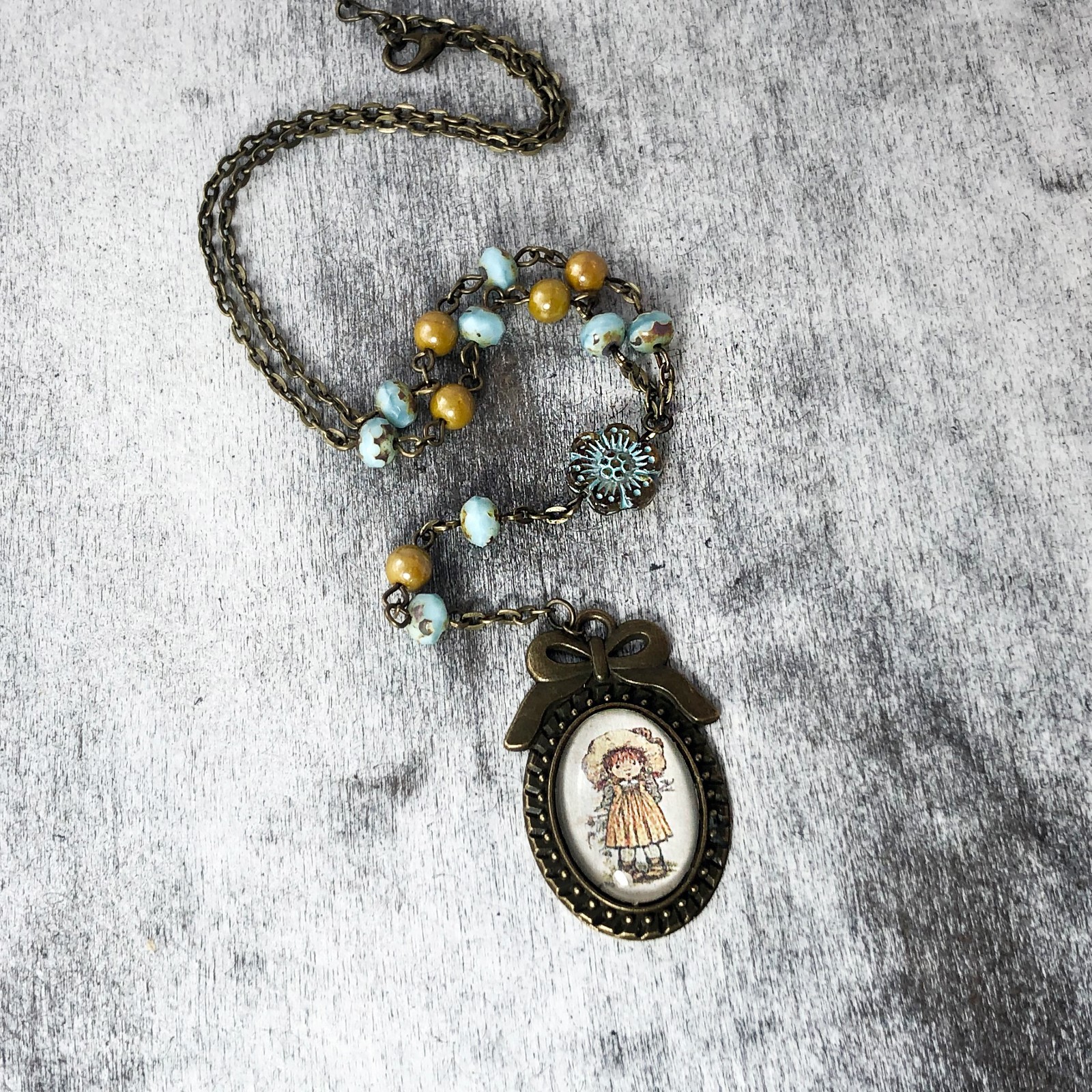 Little Girl in Bonnet and Apron Glass Cabochon, Czech Glass Powder Blue Beads