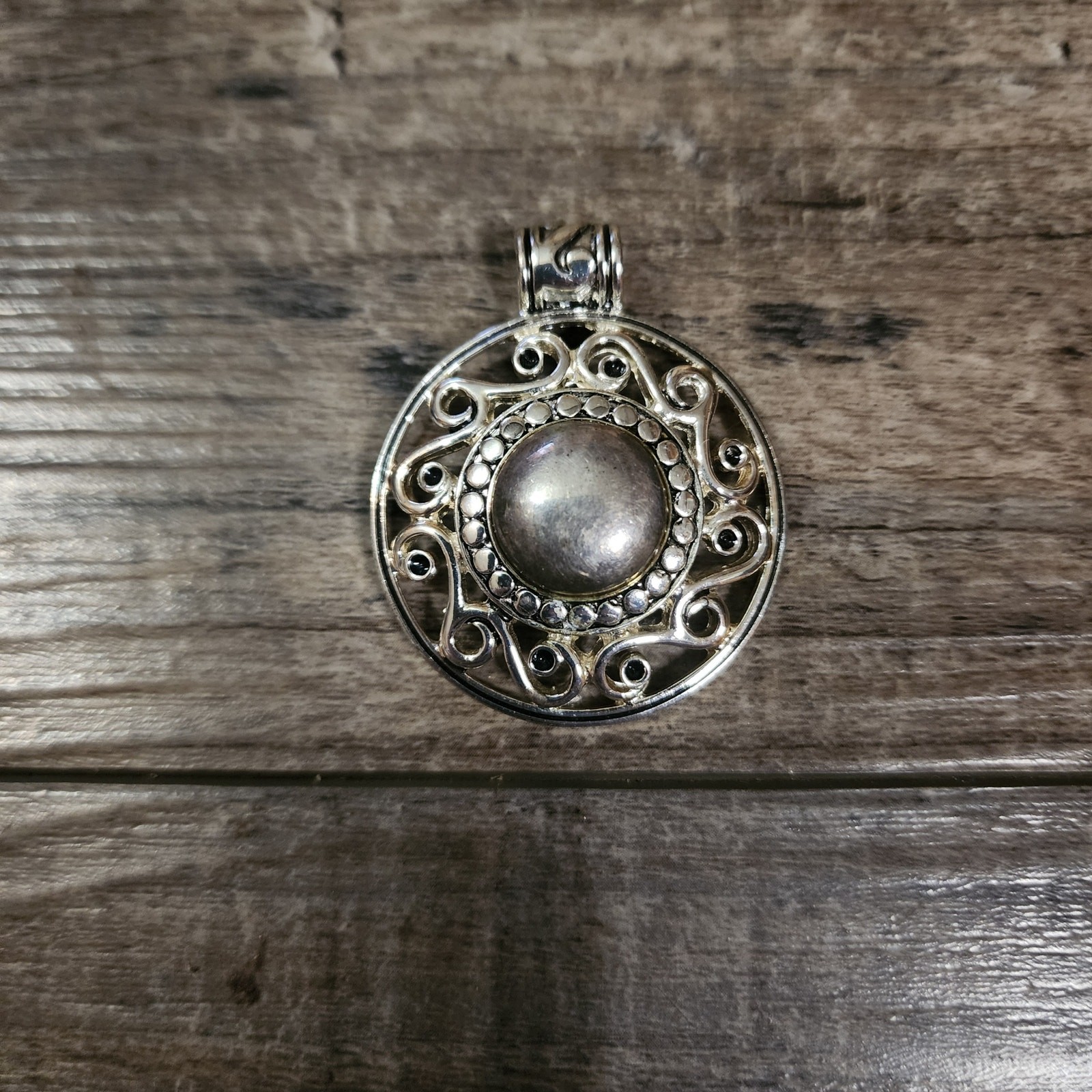 Silver colored pendant from RMN B34