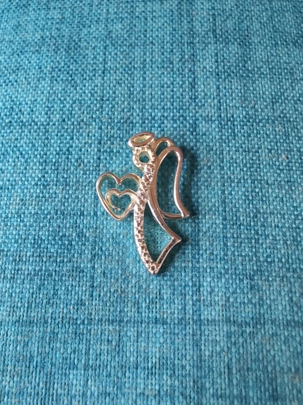 Beautiful 925 Sterling Silver CZ Angel Holding Hearts Pendant
