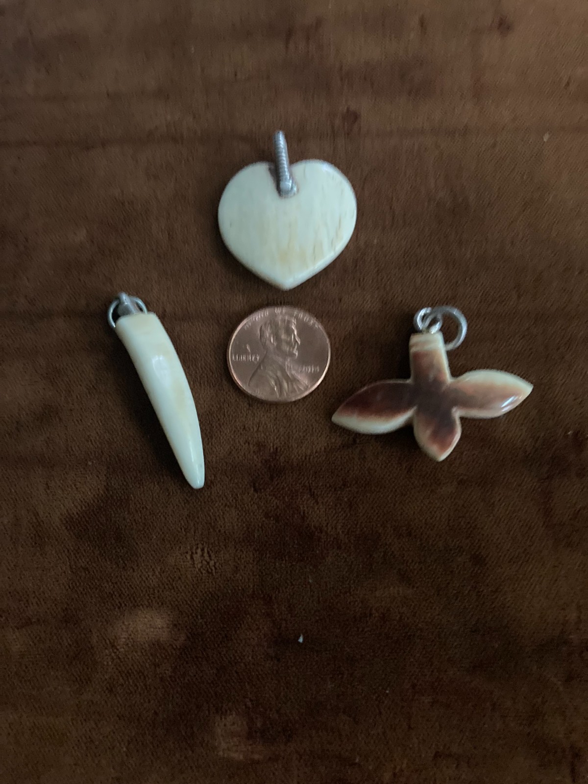 ANTIQUE HAND CARVED NEPALESE TOOTH, FLOWER AND HEART PENDANTS