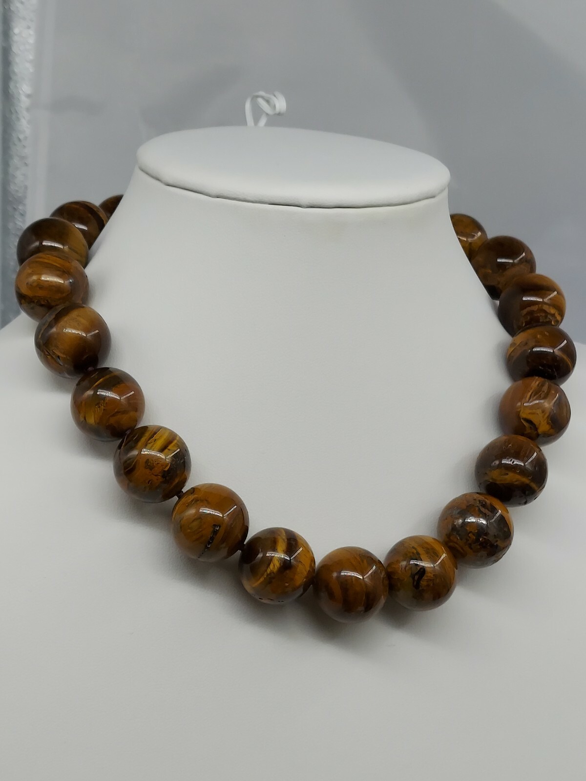 NATURAL TIGER EYE, 15:MM ROUND STONES, 17″ LONG NECKLACE, WITH A DESIGNED CLASP.