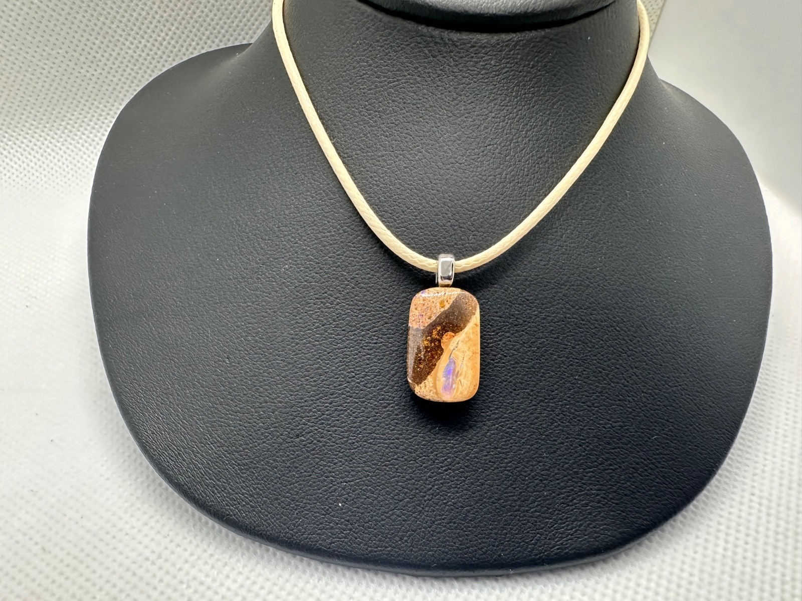 Australian boulder Opal pendant with purple color