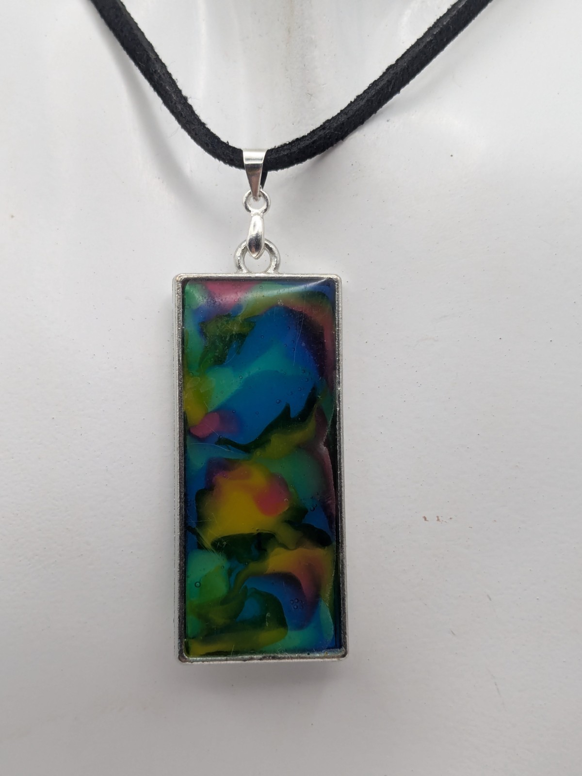 Colorful Abstract Resin Pendant On A Cord. Red Yellow Blue And Green.