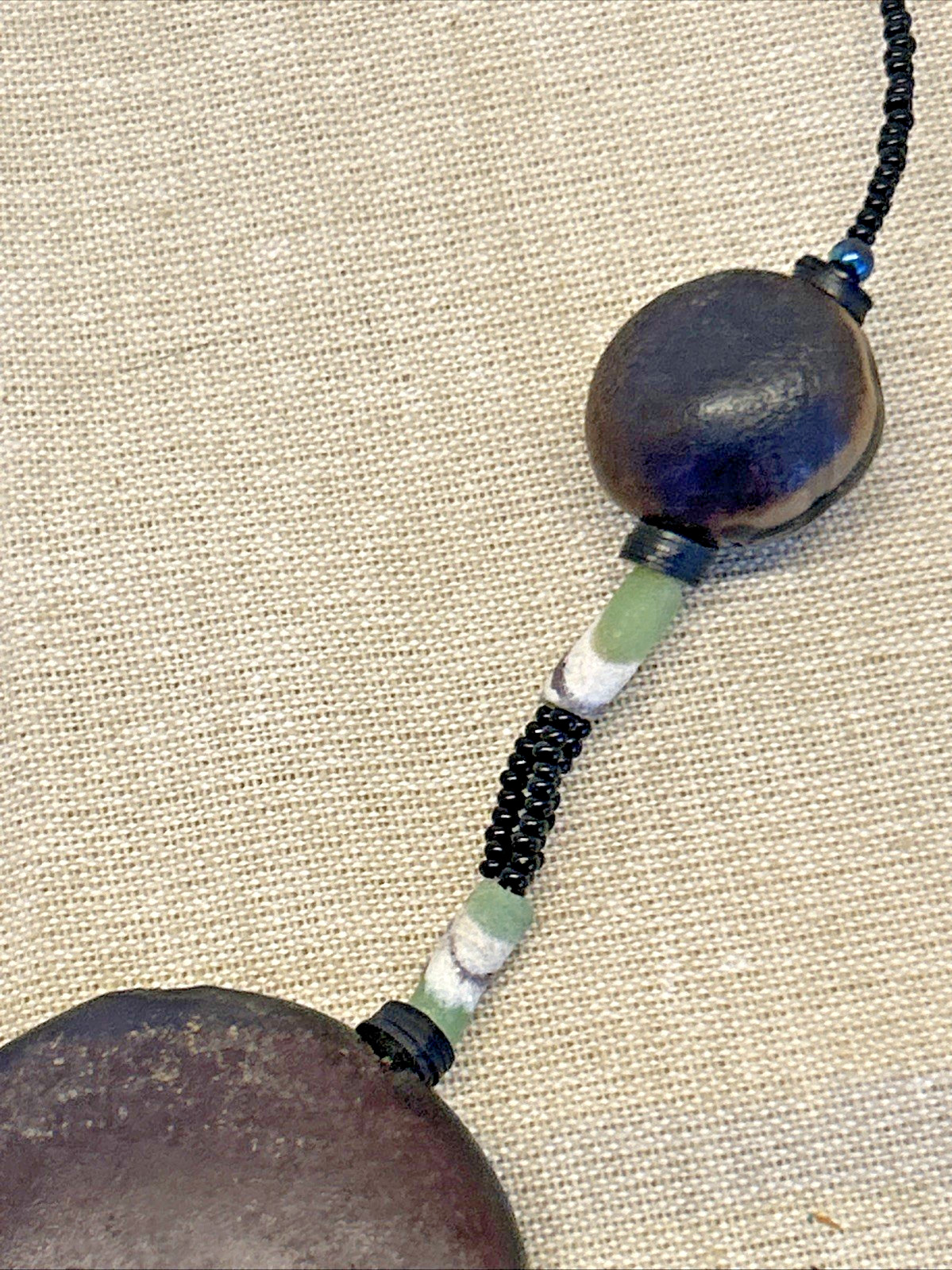 handmade boho-style natural seeds & artisanal clay beads necklace 18″