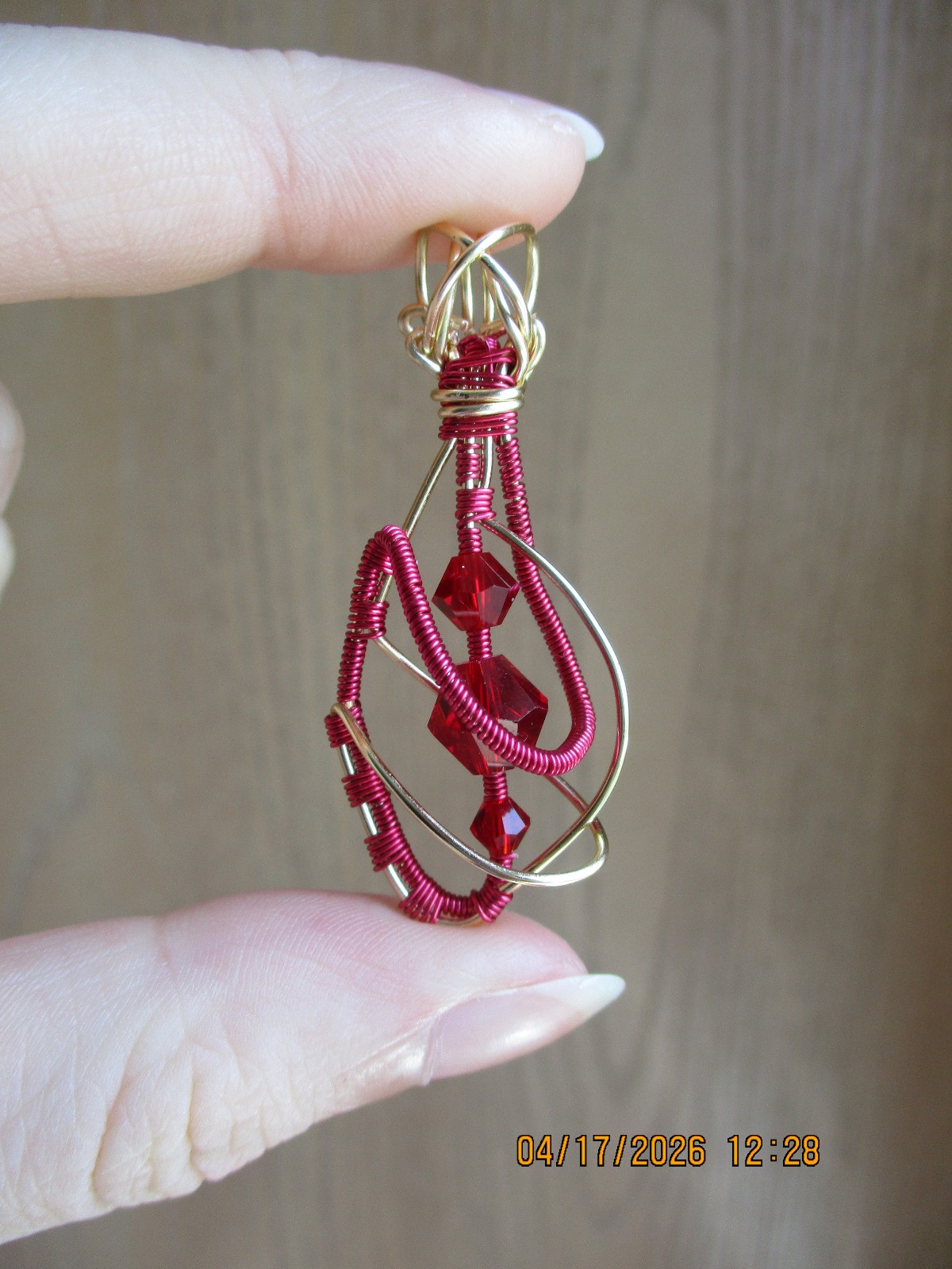 Wire wrapped glass bead pendant