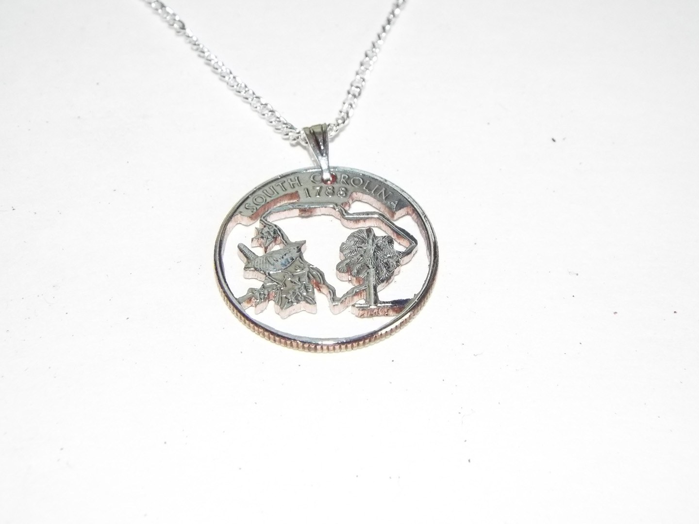 Hand Cut South Carolina Quarter as a Necklace with a 24 Inch Silver Tone Chain