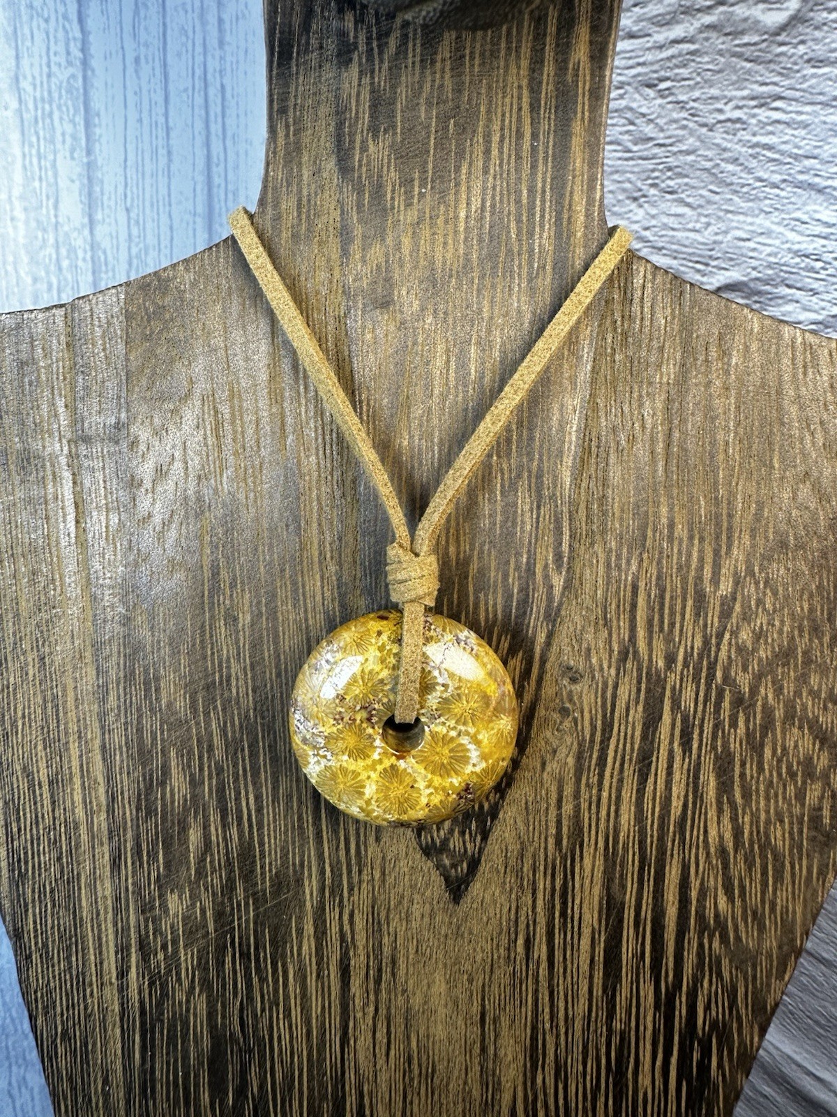 Yellow Coral Fossil Donut Pendant On Brown Faux Suede
